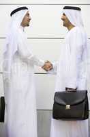 Two Middle Eastern businessmen shaking hands
