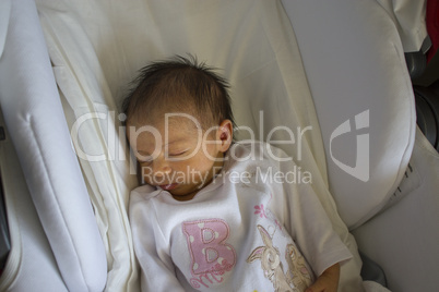 Newborn Baby Girl Sleeping in the Crib