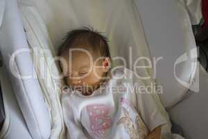 Newborn Baby Girl Sleeping in the Crib