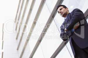 Businessman standing outside office building