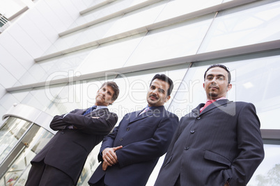 Group of businessmen outside office building
