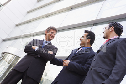 Group of businessmen outside office building