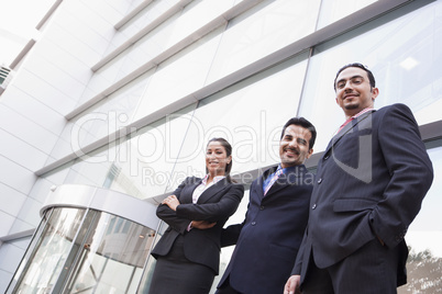 Group of business people outside office building