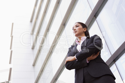 Businesswoman standing outside office building