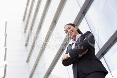 Businesswoman standing outside office building
