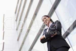 Businesswoman standing outside office building