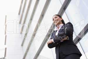 Businesswoman standing outside office building