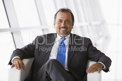 Businessman sitting in office lobby