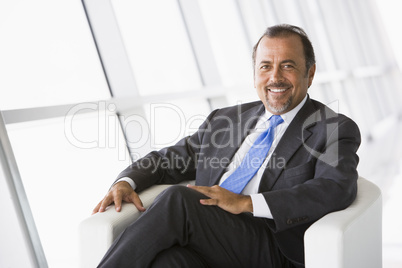 Businessman relaxing in lobby