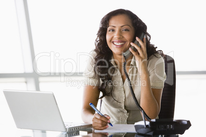 Businesswoman taking telephone call