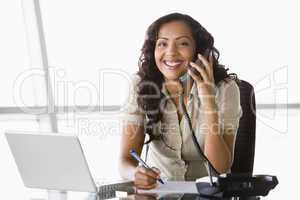 Businesswoman taking telephone call