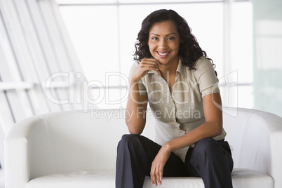 Businesswoman sitting on sofa in lobby