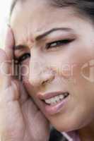 Close up of woman with headache