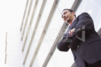 Businessman standing outstanding office