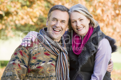 smiling elderly couple in the park
