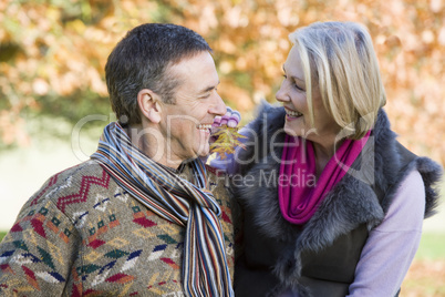 smiling elderly couple in the park