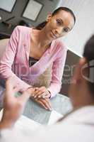 Woman having meeting with doctor in IVF clinic