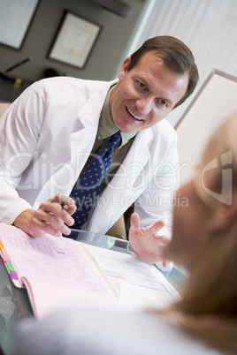 Doctor in consultation with female patient