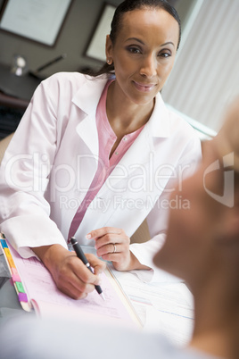 Doctor in consultation with patient in IVF clinic