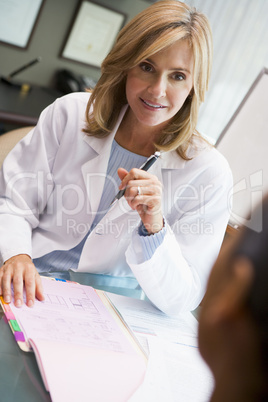 Doctor in discussion with patient in IVF clinic