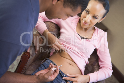 Man helping woman inject drugs to achieve pregnancy