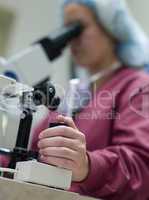 Embryologist perfoming intra cytoplasmic sperm injection