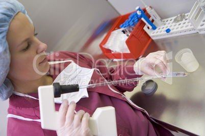 Embryologist processing sample