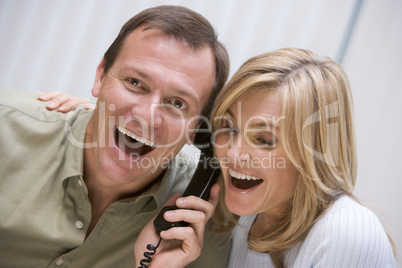 Couple receiving good news over the phone