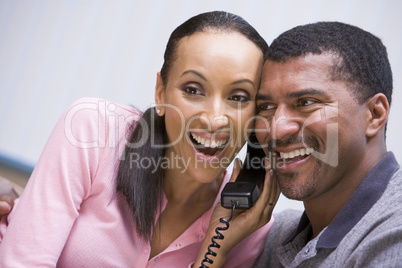Couple receiving good news over phone