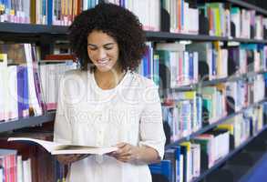 Woman reading in a library