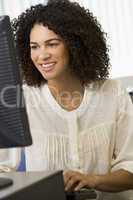 Mid adult woman working on a computer