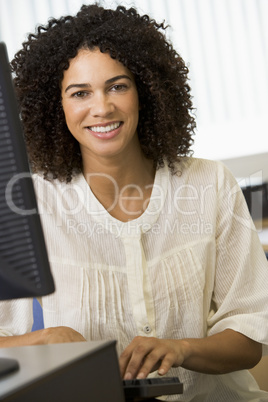 Mid adult woman working on a computer