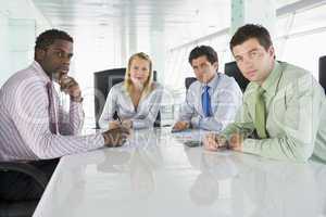 Four businesspeople in a boardroom