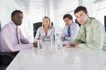 Four businesspeople in a boardroom