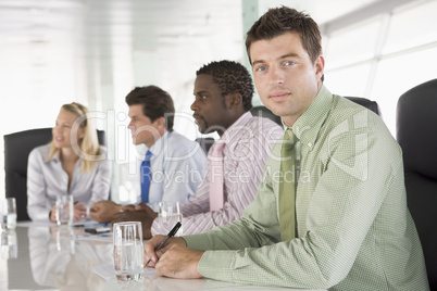 Four businesspeople in a boardroom