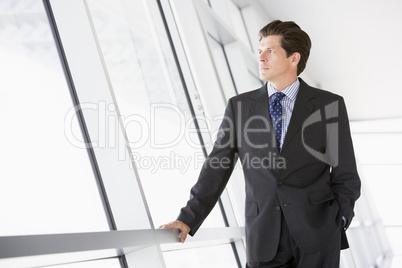 Businessman standing in corridor