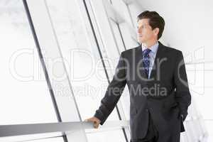 Businessman standing in corridor