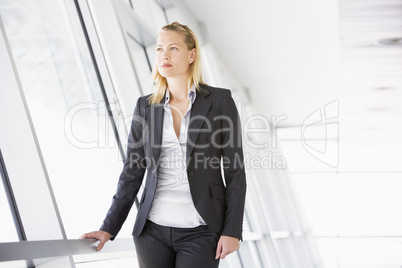 Businesswoman standing in corridor