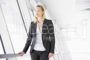 Businesswoman standing in corridor