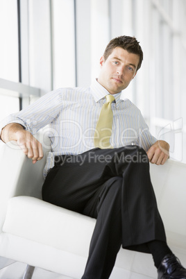 Businessman sitting in office lobby