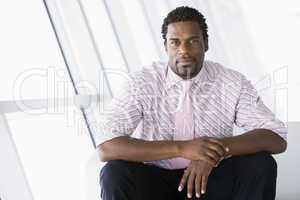 Businessman sitting in office lobby