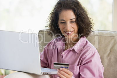 Woman making online purchase at home