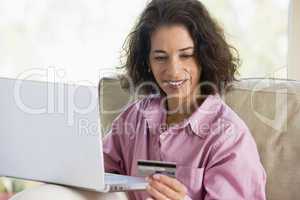 Woman making online purchase at home