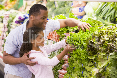 Father and daughter in produce section