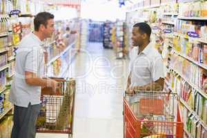 Two men meeting in supermarket