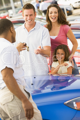 Family collecting new car