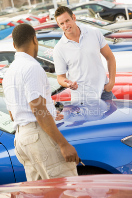 Man talking to car salesman