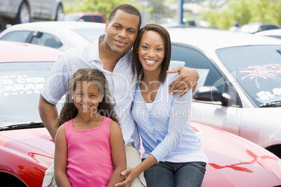 Family on new car lot