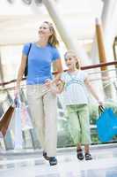 Mother and daughter shopping in mall