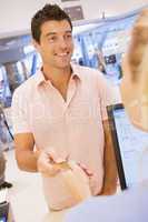 Man making purchase with credit card